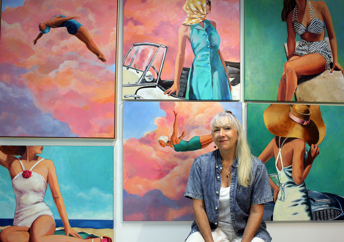 Glenda Borchard photographed in front of her artwork